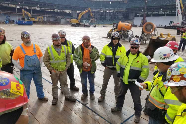 Construction workers in stadium