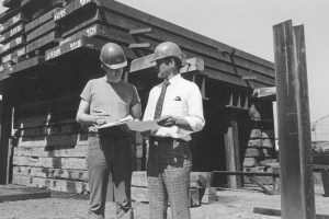 Black and white photo of construction supervisors